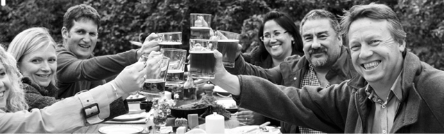 people clinking glasses of cider